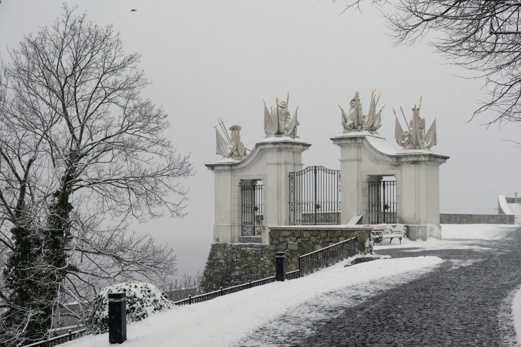 Snow-covered Baroque gate at Bratislava Castle in winter