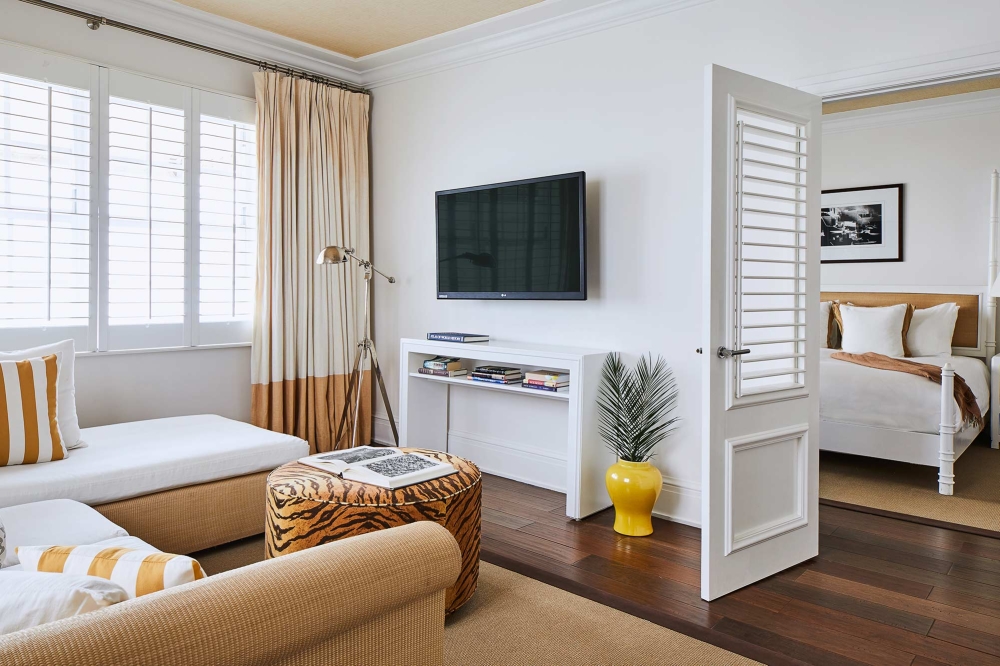 The Betsy Hotel suite with lounge area and adjoining bedroom.