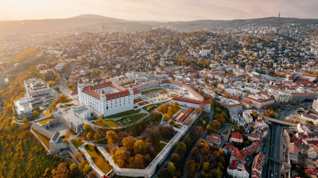 Aerial view of Bratislava Castle and Old Town at sunset