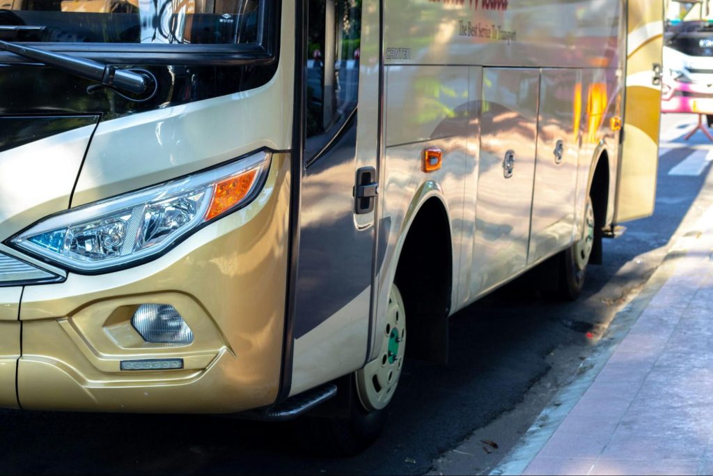 Intercity bus parked at curbside stop