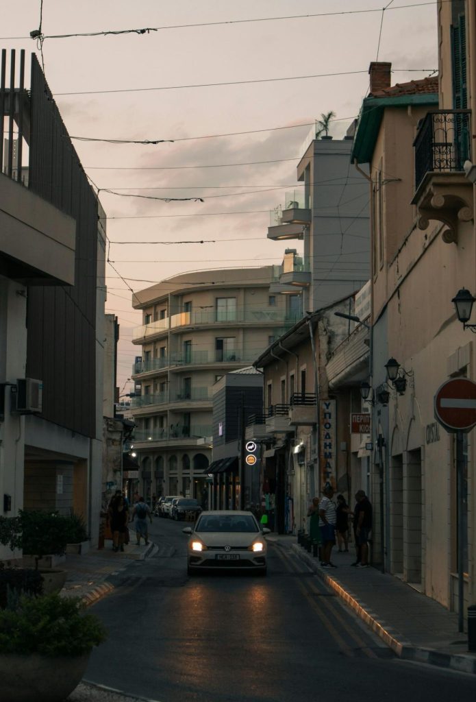 Cyprus street with car driving through town
