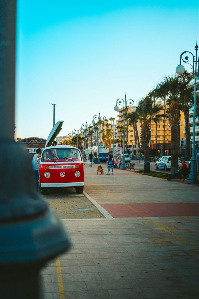 Cyprus seaside promenade with buses and palm trees